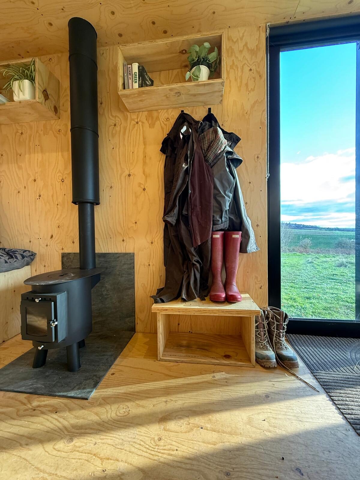 Roeka cabin interior — handbuilt plywood and timber, near Goodwood